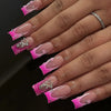 Close-up of a hand displaying pink and silver press-on nails with a striped design and star accents.