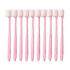 A set of ten pink ultra-fine bristle toothbrushes arranged in a row.