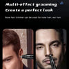 A close-up of a professional electric nose and ear hair trimmer being used on a man's face.