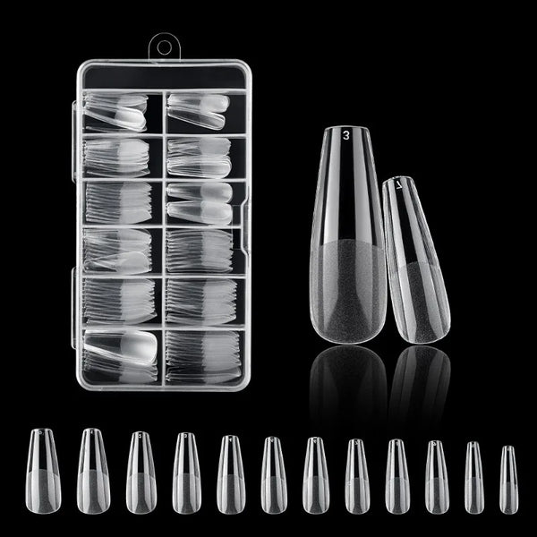 A collection of frosted French false nails in various shapes and lengths displayed on a black background.