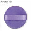 Purple makeup puff with a satin ribbon band for concealer and powder application