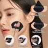 A woman applies liquid foundation using a black makeup sponge and a dry use for powdered cosmetics applicator.