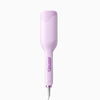 A pink professional double barrel curling iron with a cord.