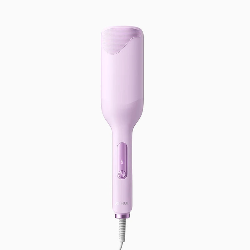 A pink professional double barrel curling iron with a cord.