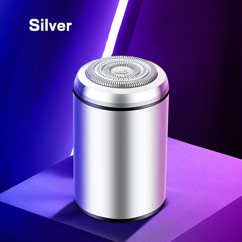Silver compact electric beard trimmer with a silver shaving head displayed on a purple background.