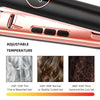 Close-up of a pink ceramic flat iron hair straightener with adjustable temperature settings.