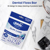A package of Oral-B Glide floss picks for dental cleaning is shown on a white surface.