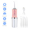 A pink and silver portable USB rechargeable dental water flosser with multiple nozzles and accessories.