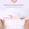 Hands hold a white disposable wet wipe with pink residue, demonstrating the durability of the spunlace process.