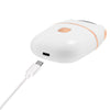 A white electric foot file callus remover device with a charging cable.