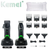 Set of Kemei electric hair clippers and trimmers including various guards and attachments