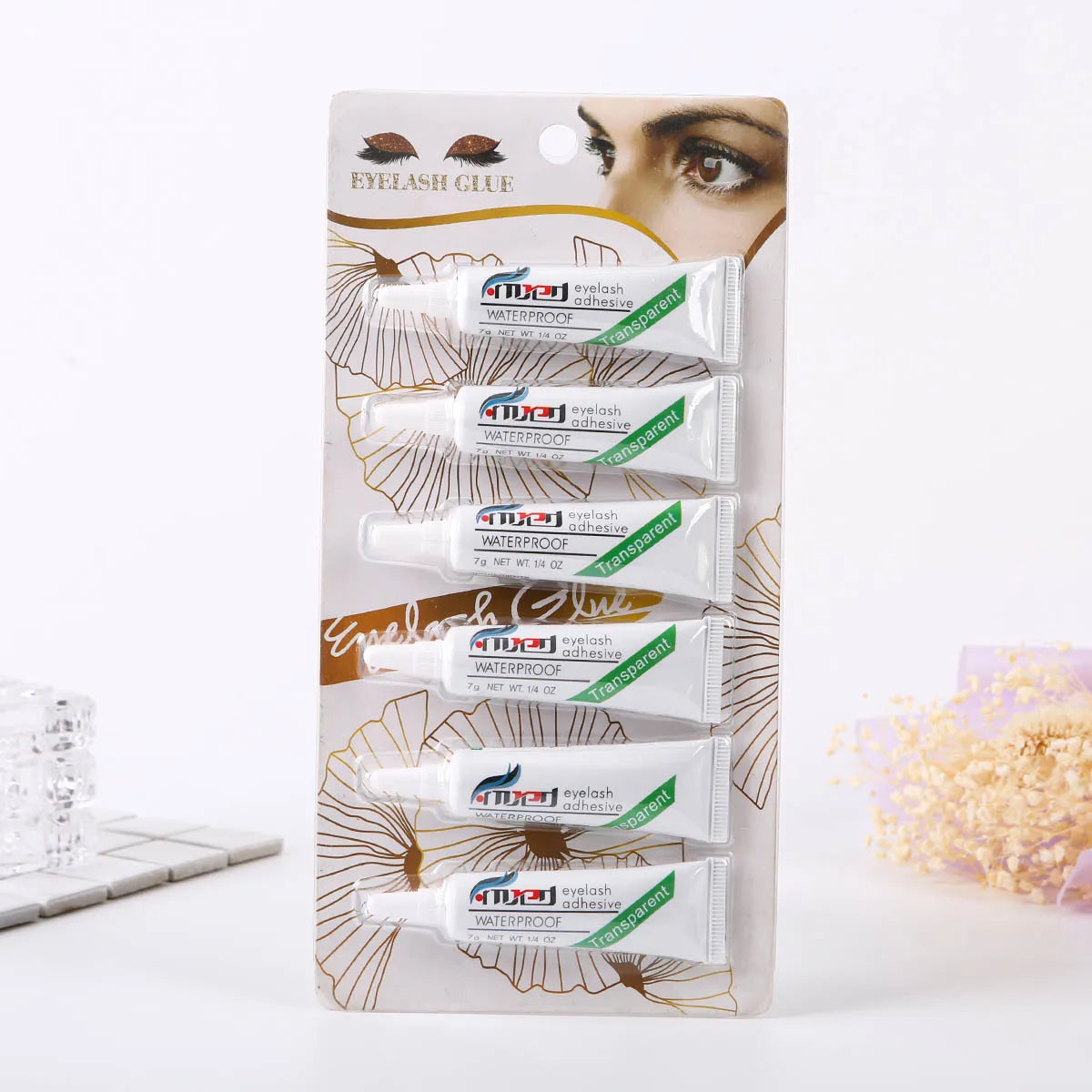 A package of MTGL eyelash adhesive glue for false lashes with multiple tubes visible.