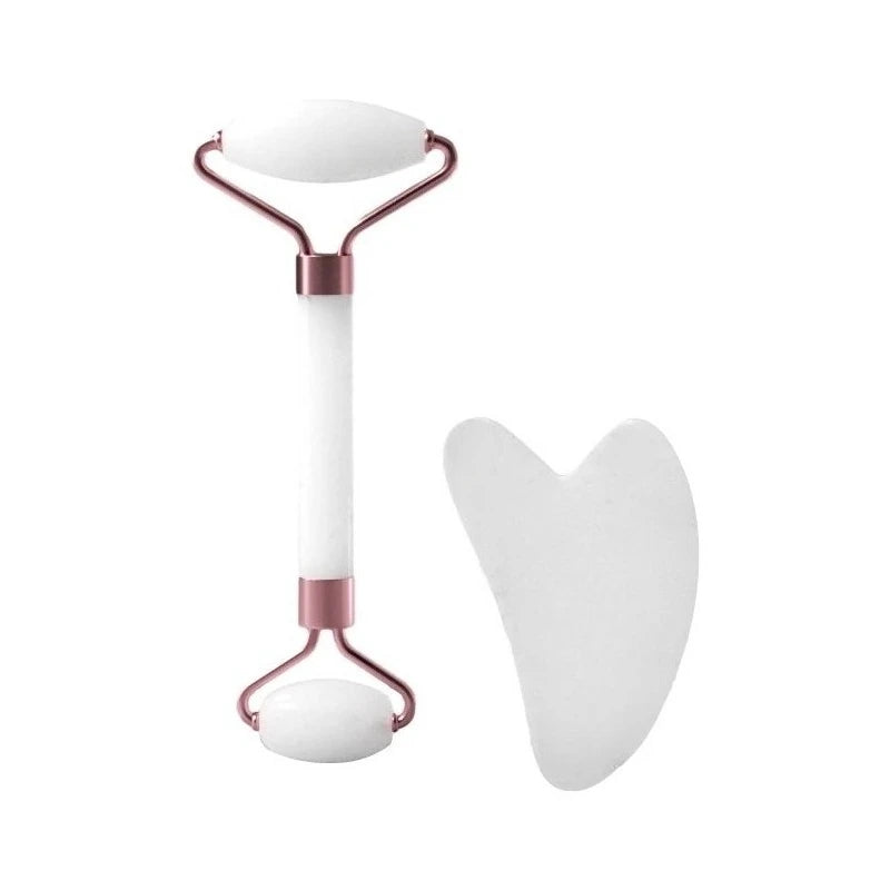 A set of two white resin facial massage rollers with rose gold accents.