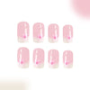 A set of 10 press-on acrylic nails painted in a soft pink color with delicate floral designs.