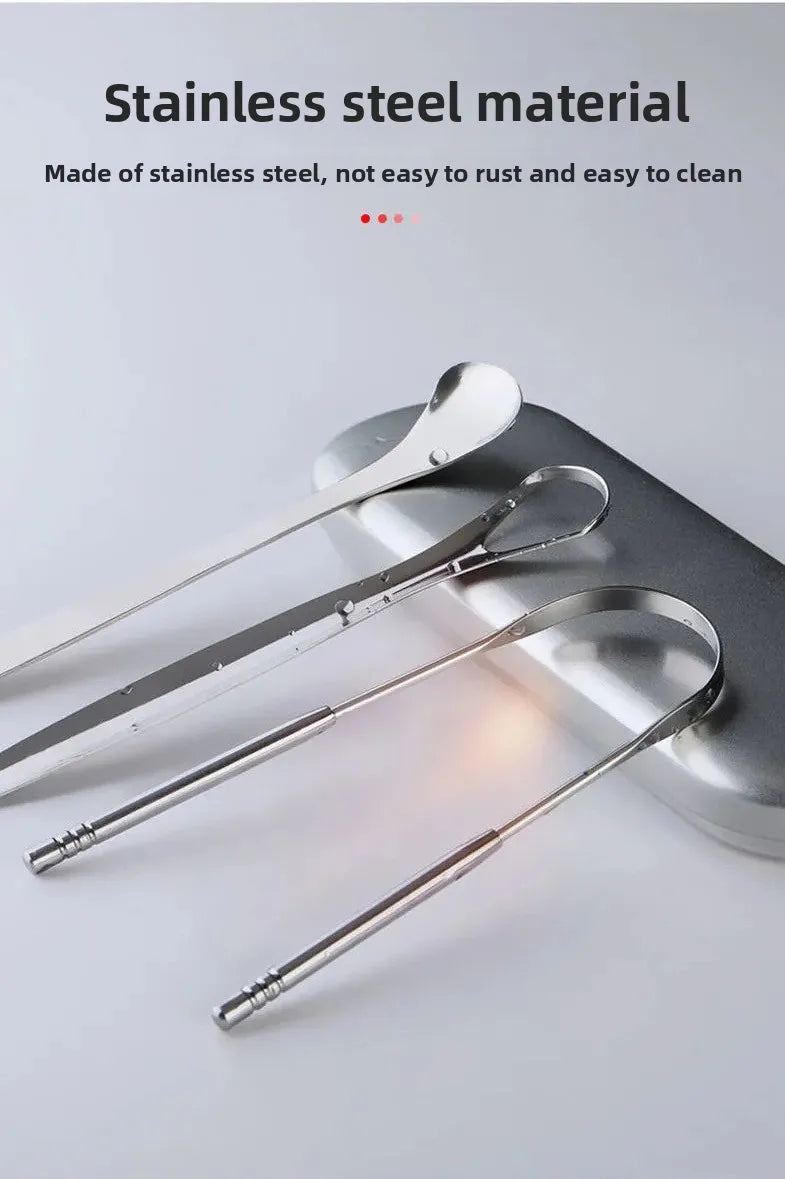 A set of stainless steel U-shaped tongue scrapers resting on a gray surface.
