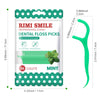 A package of mint flavored dental floss picks with a green plastic pick and a clear case.