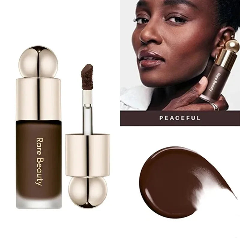 A cosmetic product featuring a gold stick applicator and a rich brown liquid foundation or contour product.