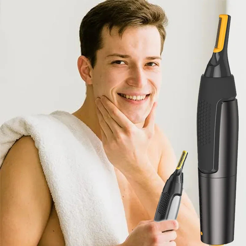 Ein Mann hält einen schwarzen Elektronase- und Ohrhaartrimmer mit orangem Tip gegen ein weißes Handtuch.