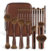 A brown makeup brush set with a matching travel case showing various brushes and a large powder brush.
