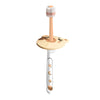 A light wood-colored baby toothbrush with a pink bristles and a cute bear design on the handle.