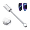 A silver nail magnet tool with a flat tip and a circular end, next to two iridescent purple and blue gradient nails.