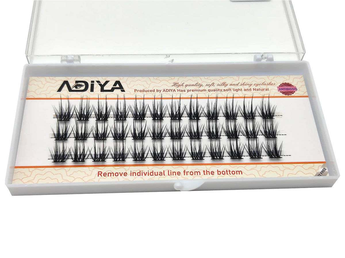 A clear box containing DIY wide stem cluster lashes for natural volume, with lash strips visible inside.