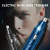 A close-up of a blue electric nose hair trimmer being held near a man's face for grooming.