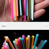 A hand holds a collection of disposable lip brushes with nylon applicator wands in various colors.