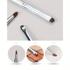 A silver precision eyeshadow brush with a brown ferrule and bristles shown in various angles.