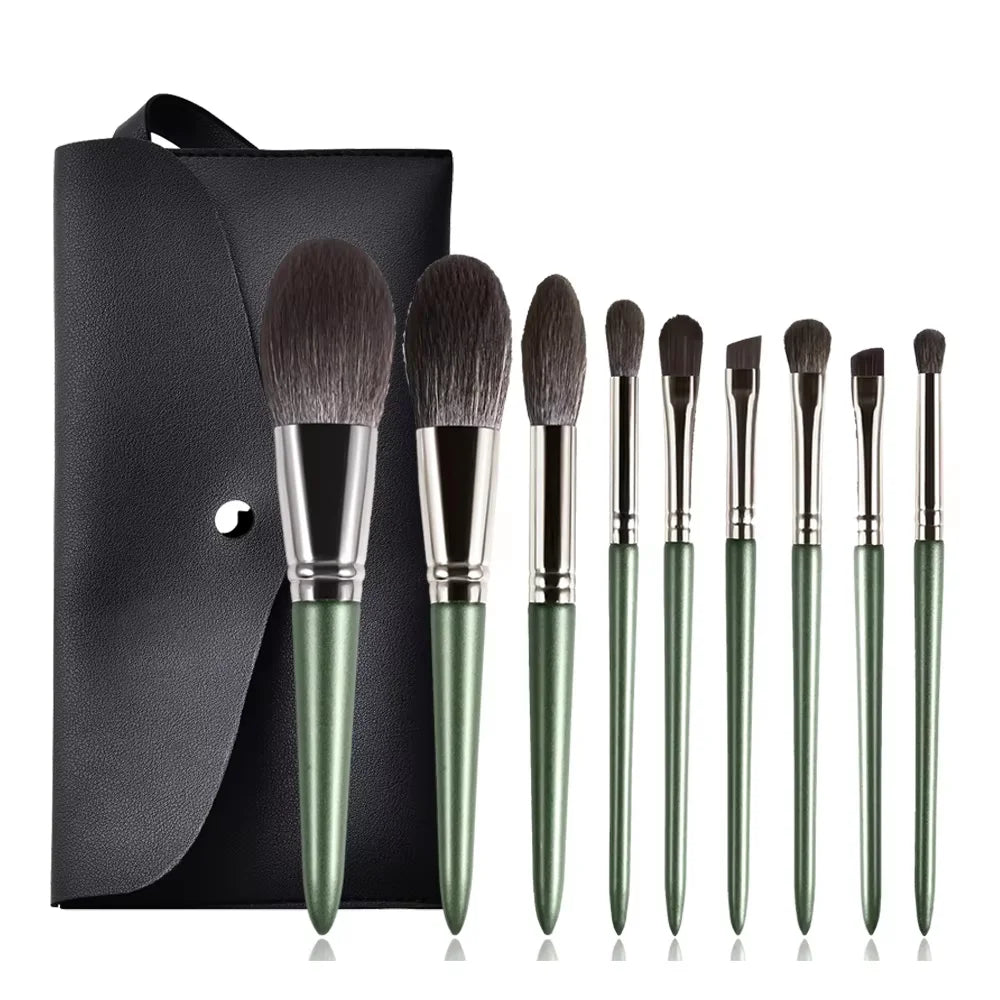 A set of green beauty sponges and applicators displayed on a black background.