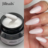 Pot de constructeur de gel pour ongles Jillnails, avec applicateur blanc et ongles manucurés.