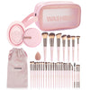 A pink washbag containing professional makeup brushes, tools, and a clean sponge.