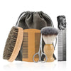 A set of boar bristle beard brush and comb with a gift bag displayed on a white surface.