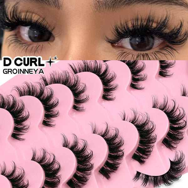 A close-up of a pink eyelash curler product with black mink false eyelashes shown on an eye.