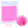Un pack de pinceaux de nettoyage et d'extension pour cils roses.