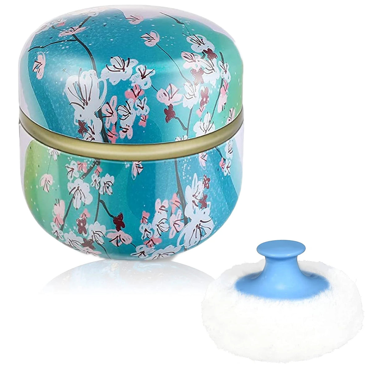 Boîte de poudre de maquillage ronde, bleu sarcelle, à motif floral avec une mèche blanche et duveteuse.
