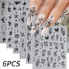 A set of six black and white floral nail decals featuring hibiscus flowers and leaves applied to a fingernail.