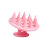 Brosse de massage portable en silicone rose avec poils multiples pour le cuir chevelu et les cheveux.