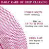 Close-up view of a pink exfoliating net bath sponge showing unique knots and texture.