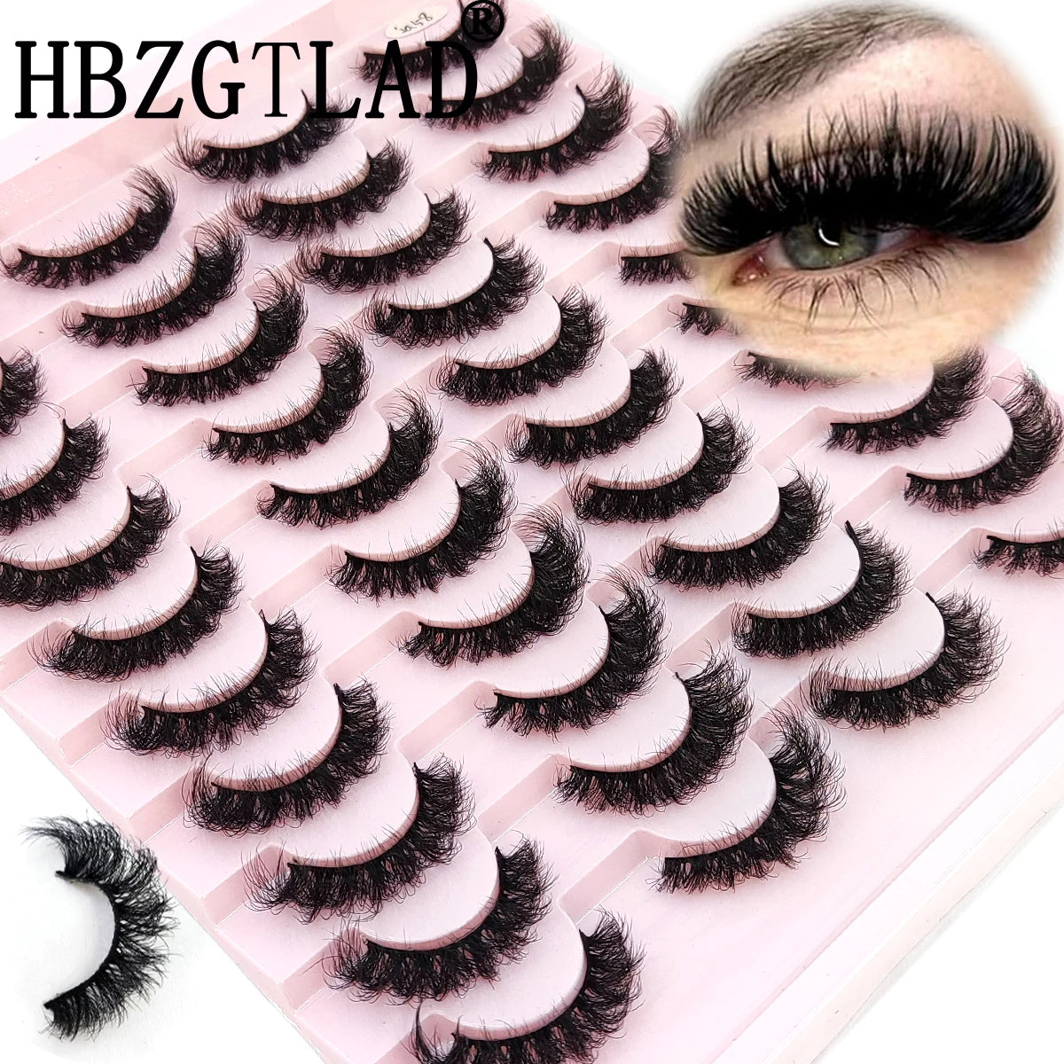 Un plateau en plastique rose présentant divers styles de faux cils à chaton en mink naturel et un gros plan sur un œil.