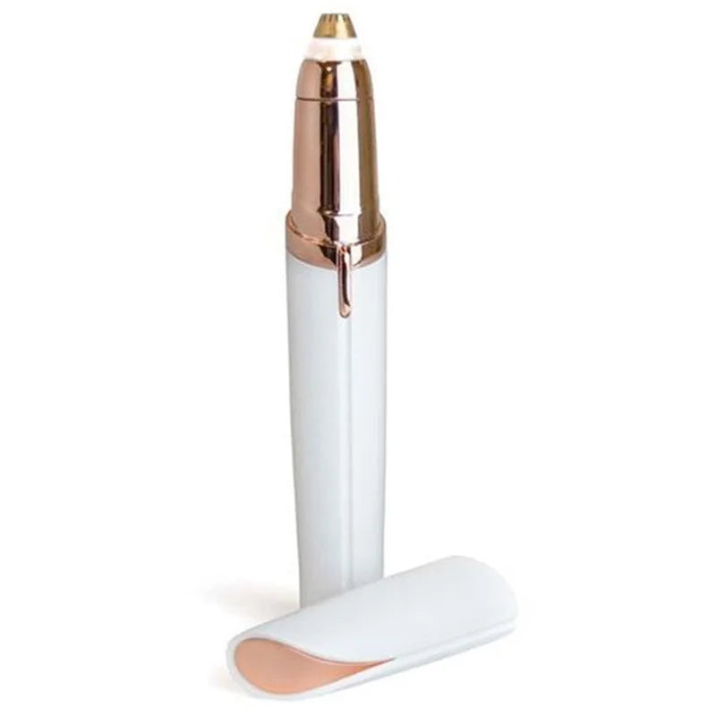 A precision electric eyebrow trimmer with a gold and white body and a flat base.