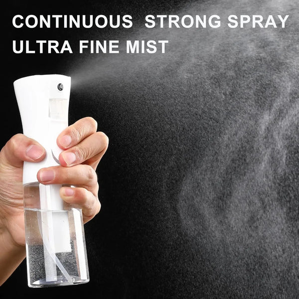 A hand holds a white high-pressure mist spray bottle, demonstrating a continuous strong spray of ultra fine mist.