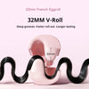 A pink 32mm V-Roll curling iron is shown with black hair being curled.
