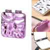 Miroir de maquillage rose iridescent carré avec couvercle articulé et design pliable.