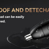 A close-up view of a black precision rechargeable nose hair trimmer being used on a dark surface.