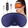 A woman is wearing an orange electric heated eye mask with a blue strap and a purple massage pad.