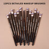 A collection of thirteen detailed makeup brushes displayed on a neutral background.