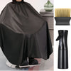 Un ensemble de cape et peigne professionnel noir pour la coupe et le coiffage, exposé sur un support.