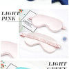 Collection de masques de sommeil en soie imitation dans diverses teintes, dont bleu marine, rose pâle et vert clair.