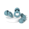 A collection of light blue silicone earplugs, including various sizes and shapes, displayed on a white surface.